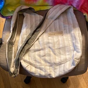 Tan and green hobo bag by Sak Saum